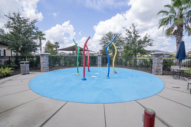 2566 Trielle Ave, Kissimmee, FL 34741 - surrounding community with playground community, fence, and a patio