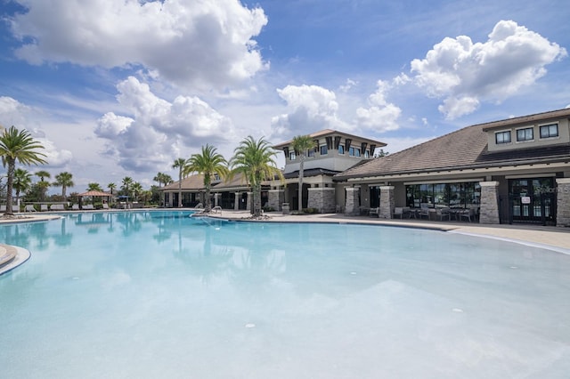 2566 Trielle Ave, Kissimmee, FL 34741 - community pool with a patio area