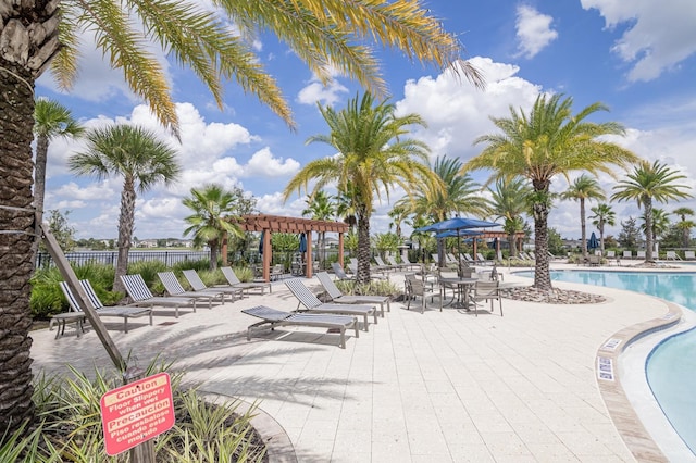 2566 Trielle Ave, Kissimmee, FL 34741 - community pool with fence, a pergola, and a patio area