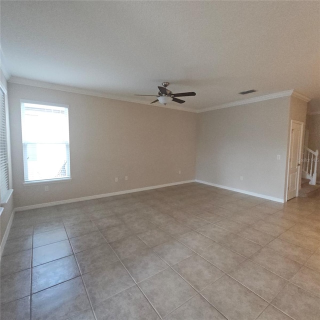 unfurnished room with light tile patterned floors, visible vents, ornamental molding, and ceiling fan