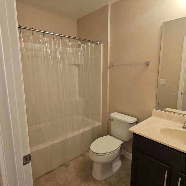 bathroom featuring tile patterned floors, toilet, vanity, and shower / bathtub combination with curtain