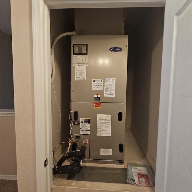 utility room featuring heating unit