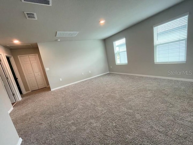 5273 Sanders Oak Trl, Saint Cloud, FL 34771 - unfurnished room featuring carpet floors, baseboards, and visible vents