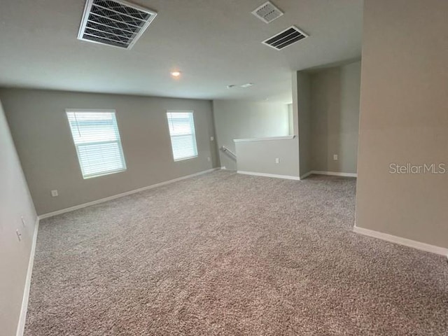 5273 Sanders Oak Trl, Saint Cloud, FL 34771 - carpeted spare room with baseboards and visible vents