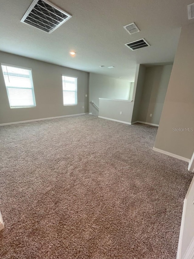 5273 Sanders Oak Trl, Saint Cloud, FL 34771 - carpeted empty room featuring visible vents and baseboards