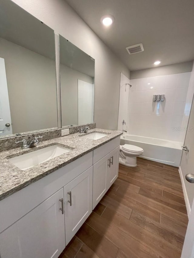 5273 Sanders Oak Trl, Saint Cloud, FL 34771 - bathroom with a sink, visible vents, toilet, and wood finished floors