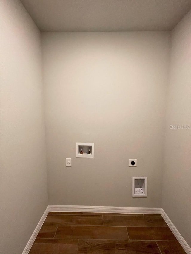 5273 Sanders Oak Trl, Saint Cloud, FL 34771 - clothes washing area with laundry area, hookup for a washing machine, wood finish floors, hookup for an electric dryer, and baseboards