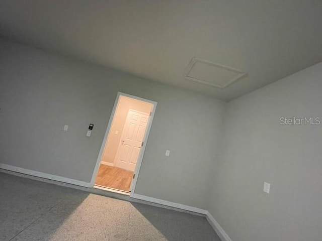 5273 Sanders Oak Trl, Saint Cloud, FL 34771 - spare room with baseboards and attic access