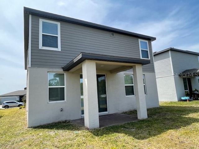 5273 Sanders Oak Trl, Saint Cloud, FL 34771 - back of property with a yard and stucco siding