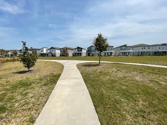 5273 Sanders Oak Trl, Saint Cloud, FL 34771 - surrounding community featuring a residential view and a lawn