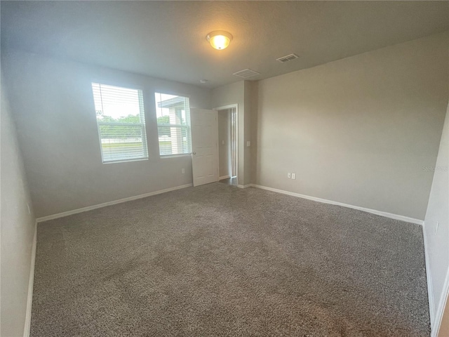 5273 Sanders Oak Trl, Saint Cloud, FL 34771 - unfurnished room with baseboards, visible vents, and carpet floors