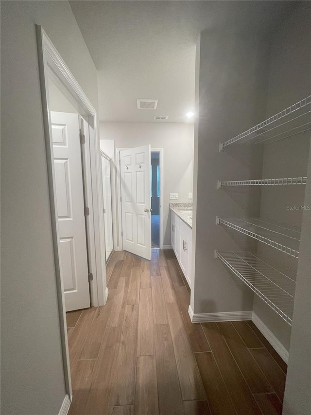 5273 Sanders Oak Trl, Saint Cloud, FL 34771 - interior space with wood finished floors, baseboards, and visible vents