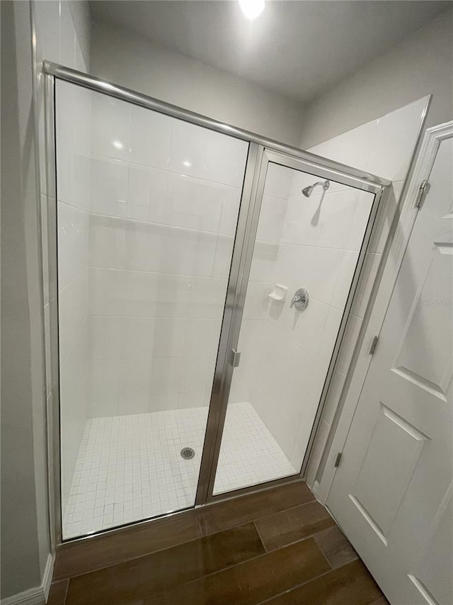5273 Sanders Oak Trl, Saint Cloud, FL 34771 - full bathroom featuring a stall shower and wood tiled floor