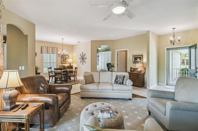 155 Cape Florida Dr, Poinciana, FL 34759 - living area with ceiling fan with notable chandelier, arched walkways, and baseboards