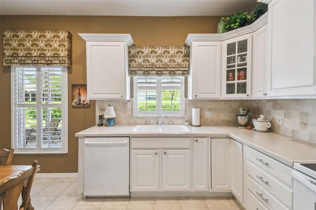 155 Cape Florida Dr, Poinciana, FL 34759 - kitchen with a sink, white cabinets, light countertops, and dishwasher