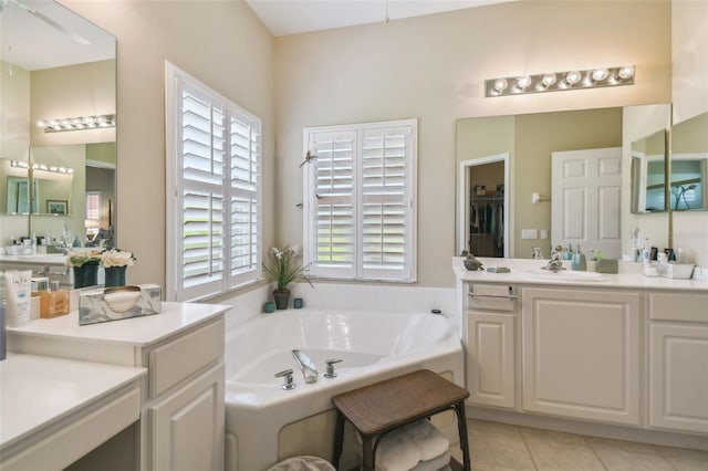 155 Cape Florida Dr, Poinciana, FL 34759 - full bathroom featuring a bath, tile patterned floors, and vanity