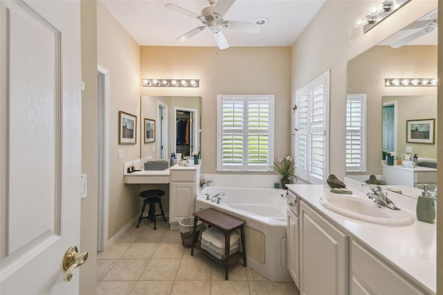 155 Cape Florida Dr, Poinciana, FL 34759 - bathroom featuring a ceiling fan, tile patterned flooring, vanity, and a garden tub