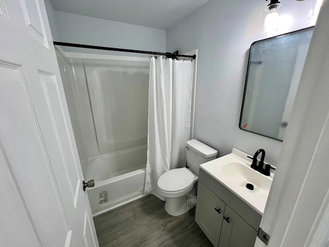 full bathroom with toilet, wood finished floors, shower / tub combo with curtain, and vanity