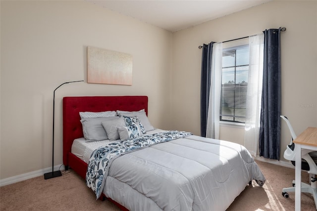 bedroom featuring baseboards and carpet floors