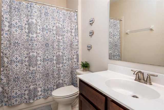 full bathroom with toilet, vanity, and a shower with curtain