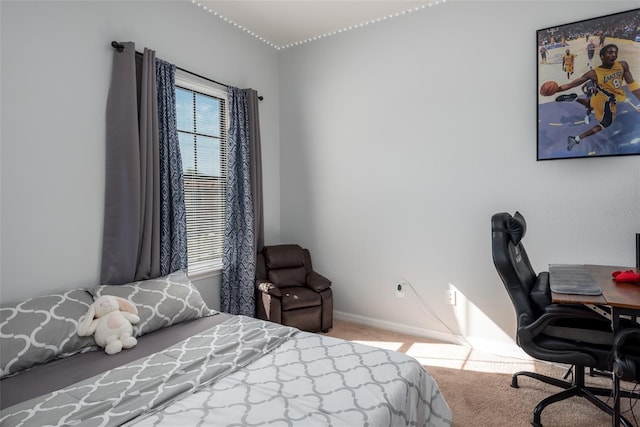 bedroom with carpet flooring, baseboards, and multiple windows