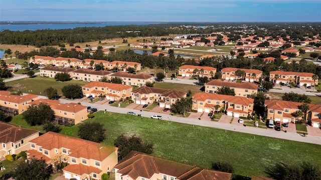 birds eye view of property featuring a residential view and a water view