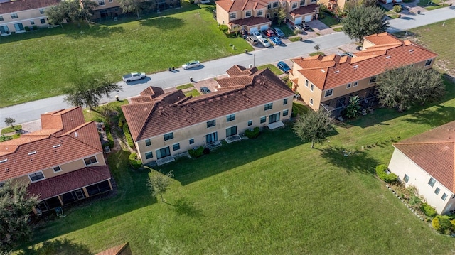 birds eye view of property with a residential view
