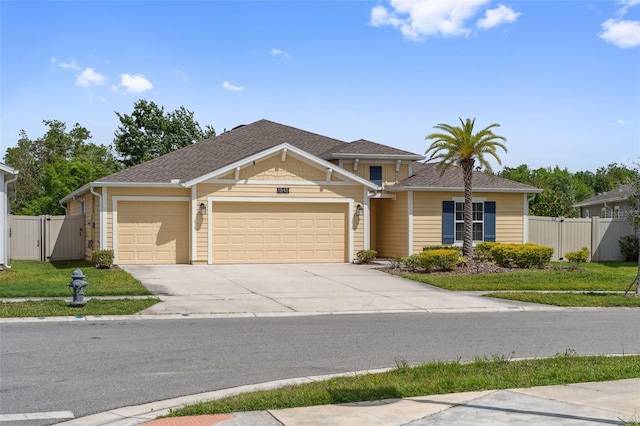1848 Ancestry Trl, Kissimmee, FL 34746 - traditional-style home with a gate, an attached garage, and driveway
