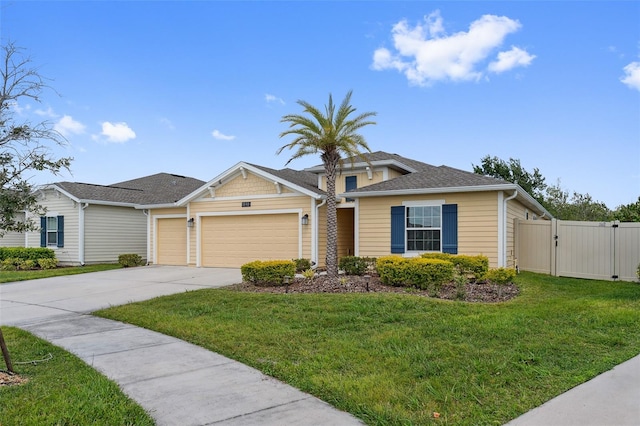 1848 Ancestry Trl, Kissimmee, FL 34746 - view of front of home with an attached garage, driveway, a gate, and roof with shingles