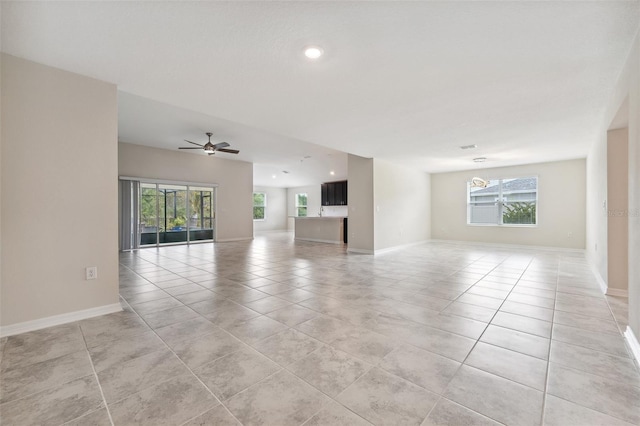 1848 Ancestry Trl, Kissimmee, FL 34746 - unfurnished room featuring light tile patterned floors, recessed lighting, ceiling fan, and a chandelier