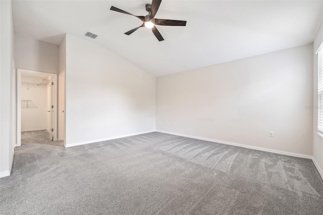 1848 Ancestry Trl, Kissimmee, FL 34746 - spare room with a ceiling fan, carpet flooring, and vaulted ceiling