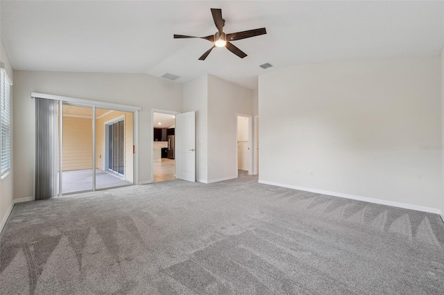 1848 Ancestry Trl, Kissimmee, FL 34746 - unfurnished bedroom with access to exterior, carpet flooring, vaulted ceiling, ceiling fan, and freestanding refrigerator