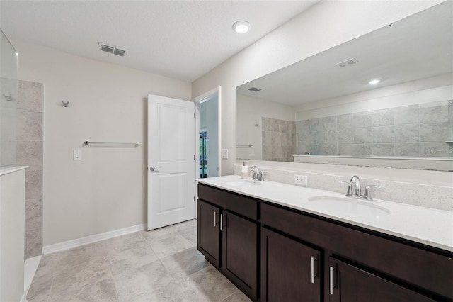 1848 Ancestry Trl, Kissimmee, FL 34746 - full bathroom featuring double vanity, a walk in shower, and tile patterned floors