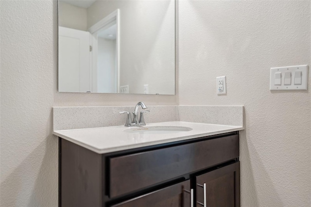 1848 Ancestry Trl, Kissimmee, FL 34746 - bathroom featuring vanity and a textured wall