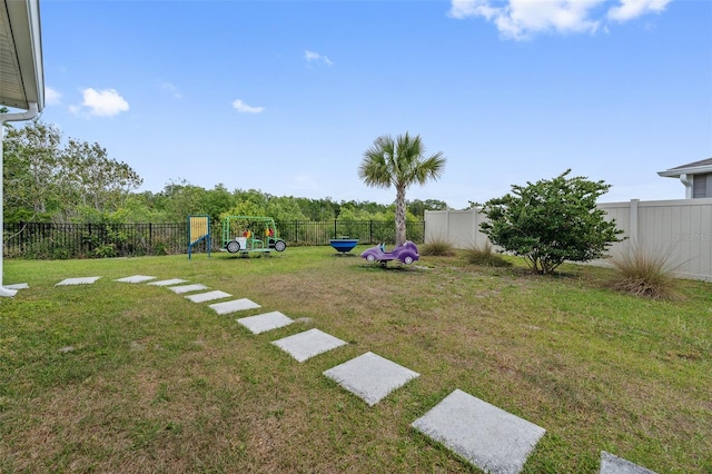 1848 Ancestry Trl, Kissimmee, FL 34746 - fenced backyard with a playground