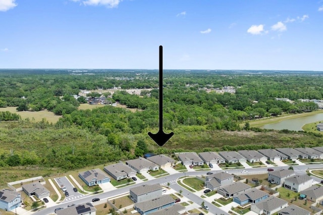 1848 Ancestry Trl, Kissimmee, FL 34746 - aerial perspective of suburban area featuring a heavily wooded area and a nearby body of water