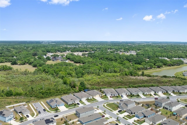 1848 Ancestry Trl, Kissimmee, FL 34746 - aerial perspective of suburban area with a forest and a nearby body of water