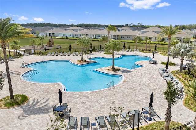 1848 Ancestry Trl, Kissimmee, FL 34746 - community pool featuring a residential view and a patio