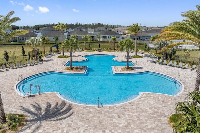 1848 Ancestry Trl, Kissimmee, FL 34746 - community pool featuring a residential view and a patio