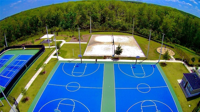 1848 Ancestry Trl, Kissimmee, FL 34746 - view of basketball court with a forest view, community basketball court, and a yard