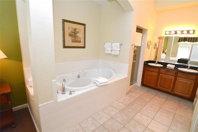 8100 Poinciana Blvd Unit 2111, Orlando, FL 32821 - bathroom featuring a bath, vanity, tile patterned flooring, and a shower stall