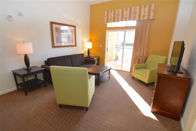 8100 Poinciana Blvd Unit 2111, Orlando, FL 32821 - carpeted living area with baseboards and a high ceiling