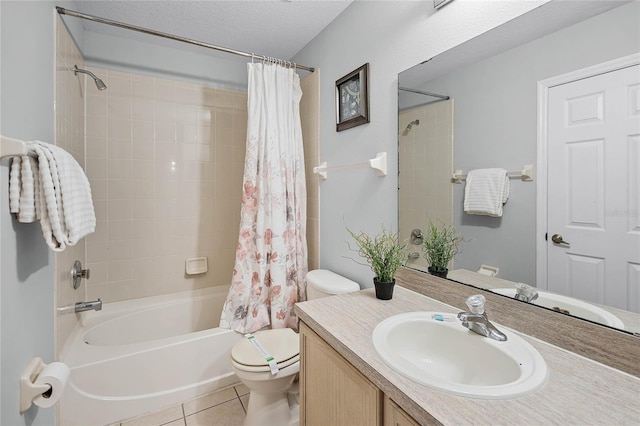 bathroom with toilet, vanity, shower / bathtub combination with curtain, a textured ceiling, and tile patterned flooring