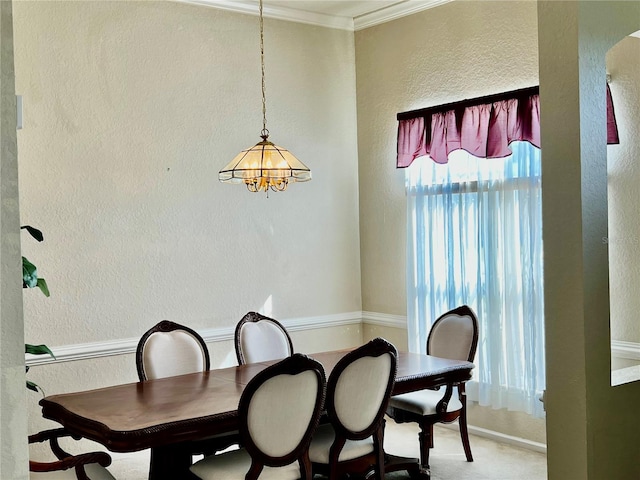 2920 River Birch Dr, Kissimmee, FL 34741 - dining room with a textured wall, a chandelier, crown molding, and light colored carpet