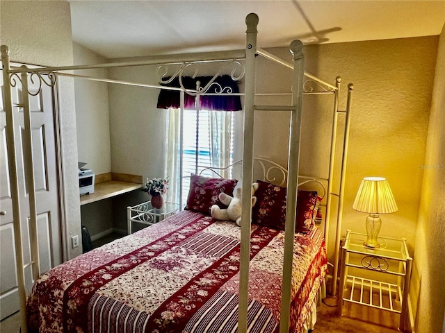2920 River Birch Dr, Kissimmee, FL 34741 - bedroom featuring wood finished floors and a textured wall