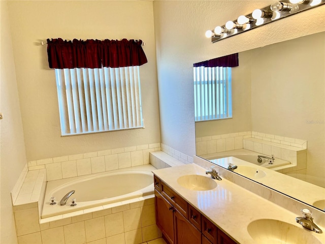 2920 River Birch Dr, Kissimmee, FL 34741 - bathroom with double vanity, a bath, and a sink
