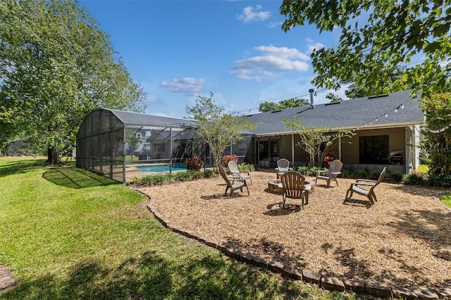 1999 Sir Lancelot Cir, Saint Cloud, FL 34772 - back of property featuring glass enclosure, an outdoor pool, a fire pit, a yard, and a patio