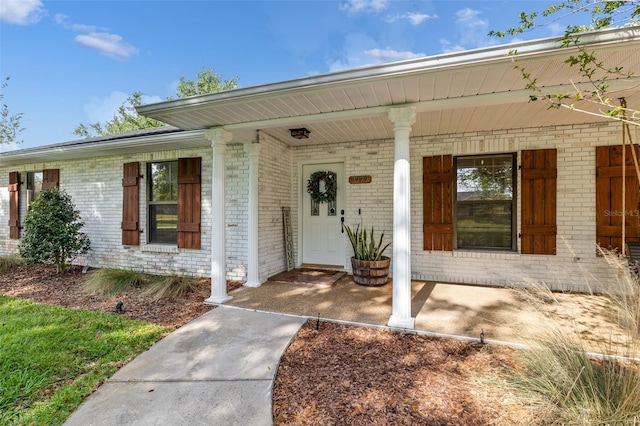1999 Sir Lancelot Cir, Saint Cloud, FL 34772 - view of exterior entry with brick siding and a porch