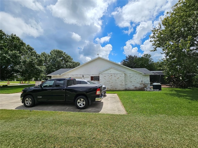 1999 Sir Lancelot Cir, Saint Cloud, FL 34772 - view of home's exterior featuring a lawn