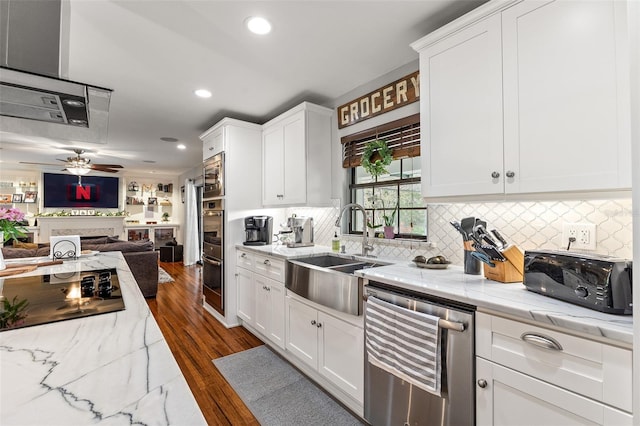 1999 Sir Lancelot Cir, Saint Cloud, FL 34772 - kitchen with open floor plan, a sink, and white cabinetry